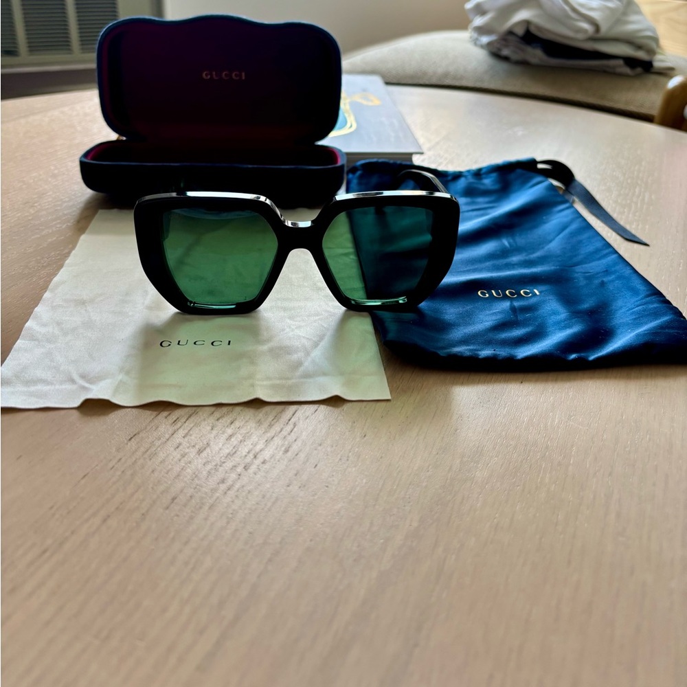 Gucci Black Frame Sunglasses with Green Lenses